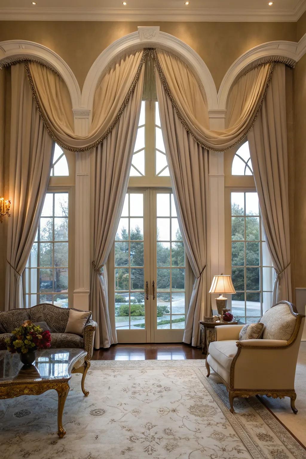 An elegant parlor showcases drape panels that frame arched windows, creating an inviting atmosphere.