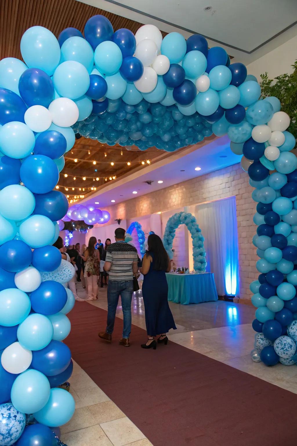 A striking blue balloon arch creates an enchanting, whimsical party ambiance.