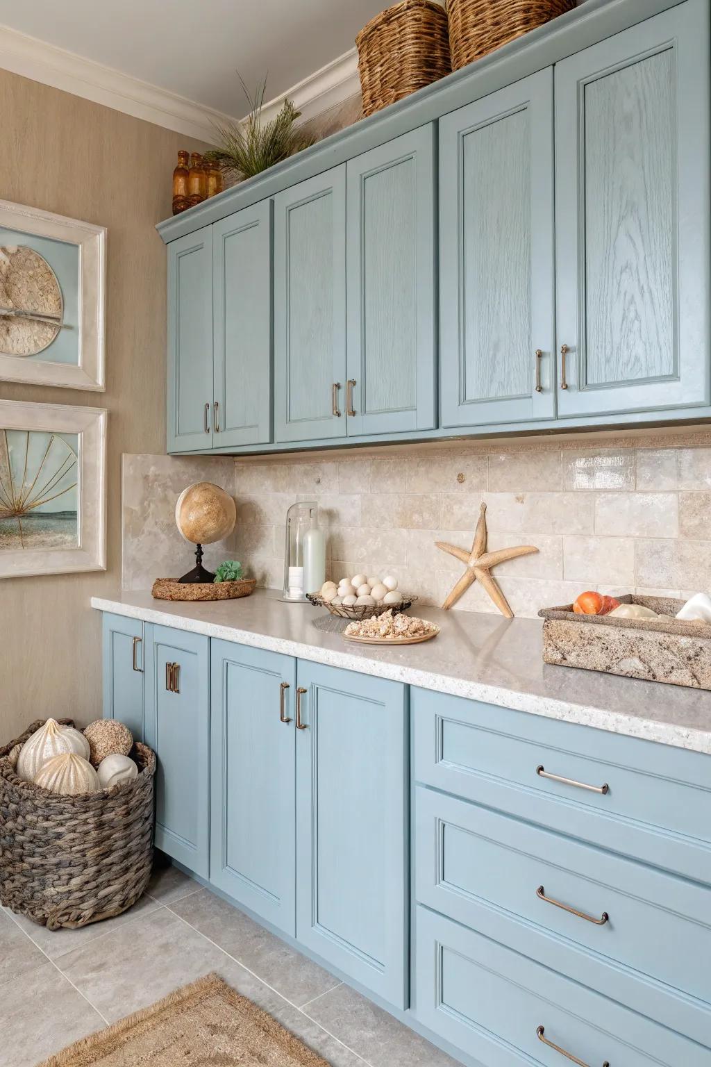 A kitchen channeling coastal colors with delicate blues and sandy creams.