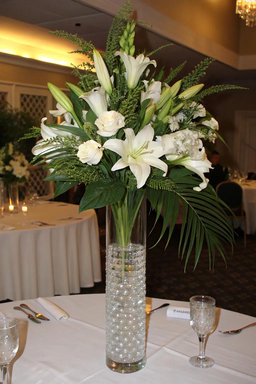 A timeless floral composition featuring tall white lilies and verdant greenery.