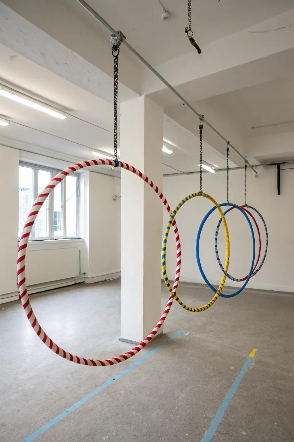 Hula hoops suspended from overhead hangers, creating a functional and artistic display.