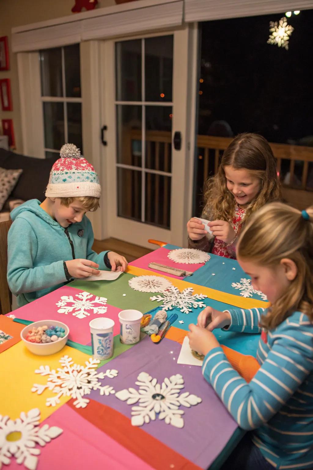 Children absorbed in imaginative winter crafts at a brightly colored table.