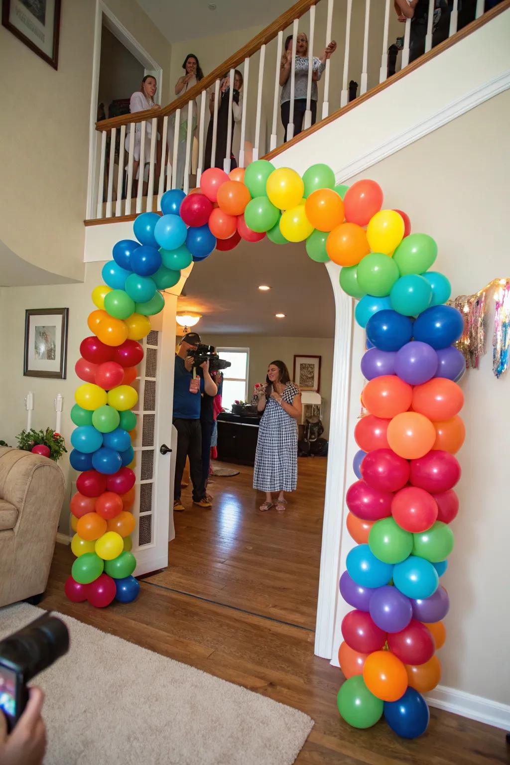 A lively balloon arch establishes a celebratory atmosphere at the graduation celebration.