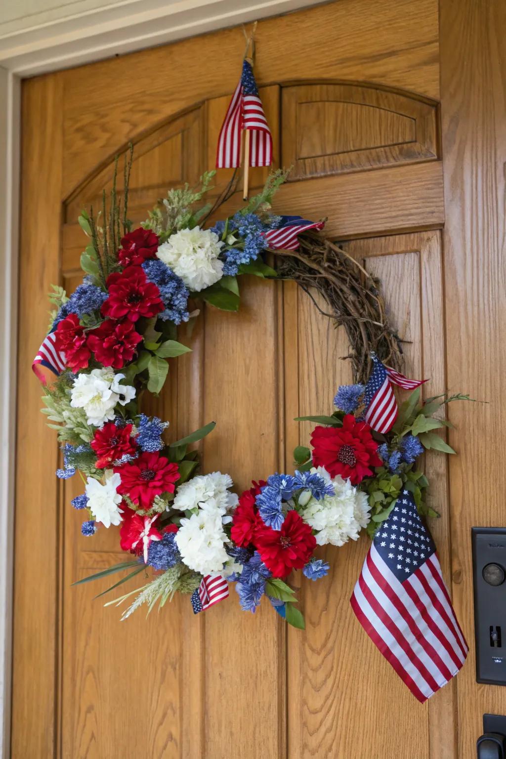 A classic Americana wreath adorned with flowers and flags.