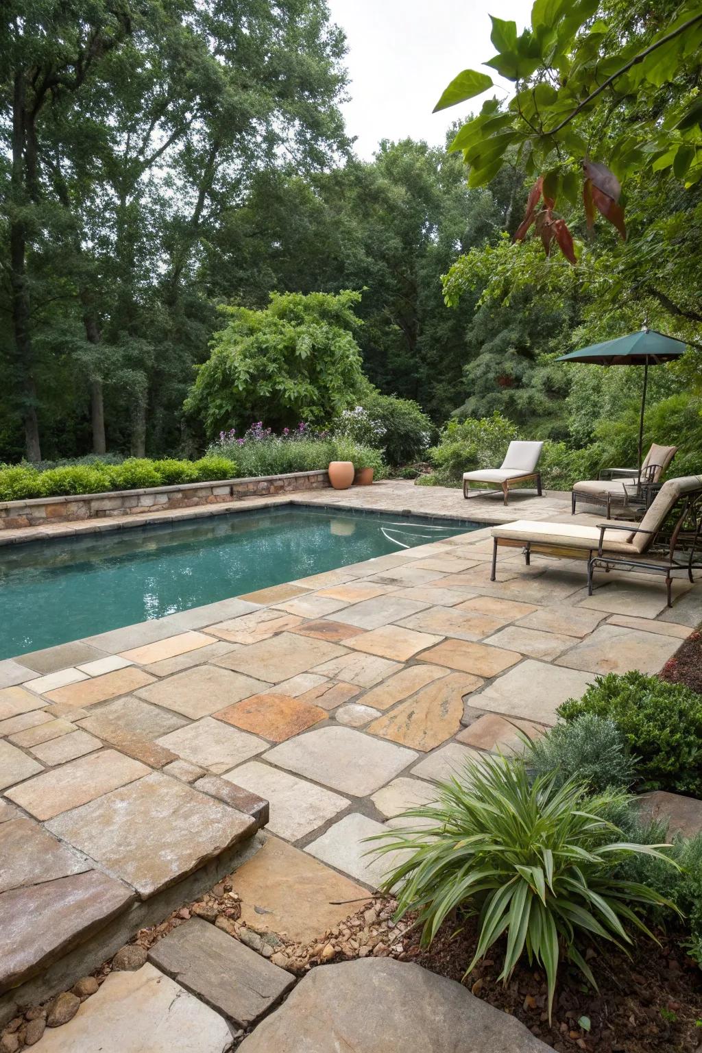 Organic stone pavers offer a classic, natural beauty to this pool area.