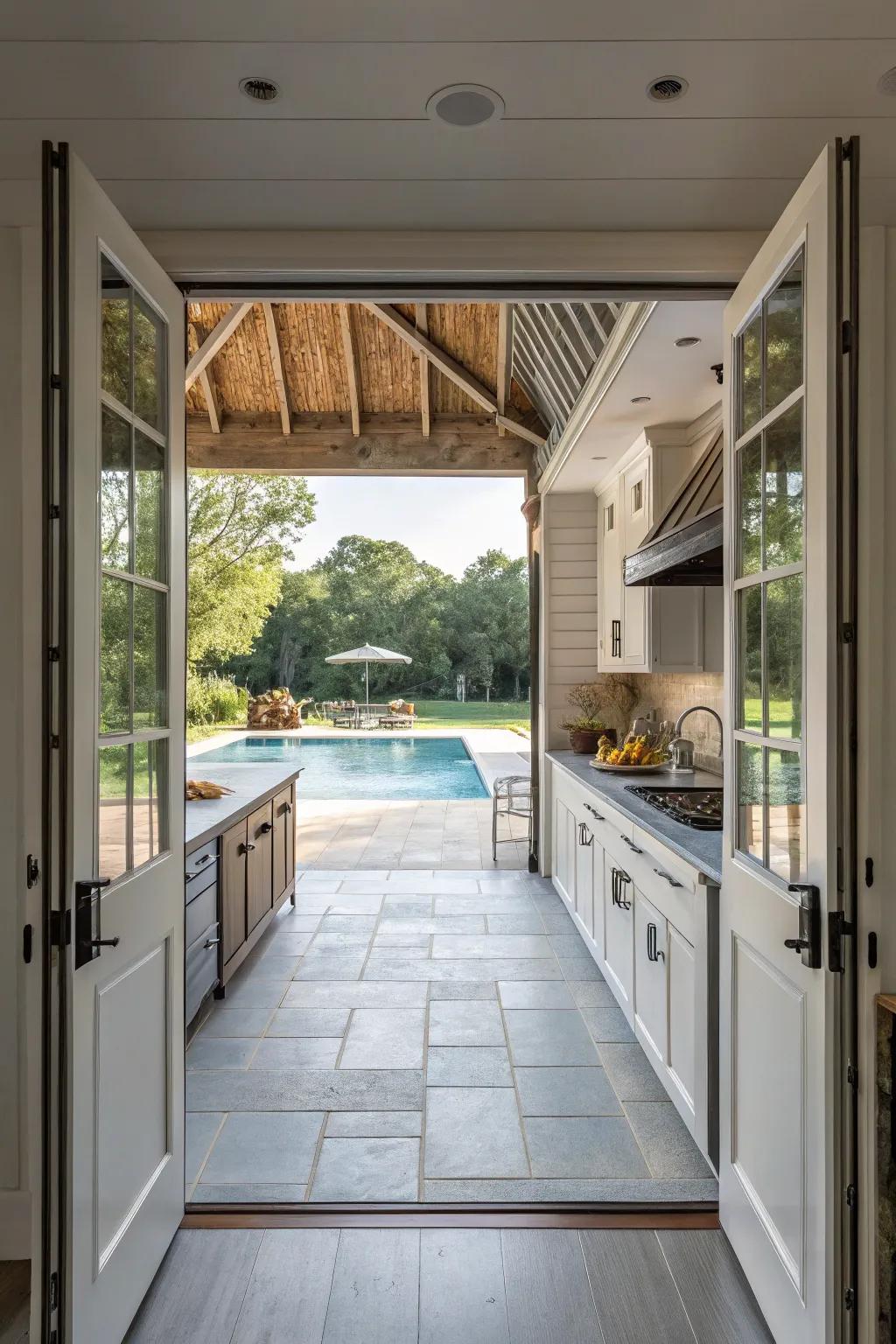Open-air kitchen flawlessly merging with the poolside area.
