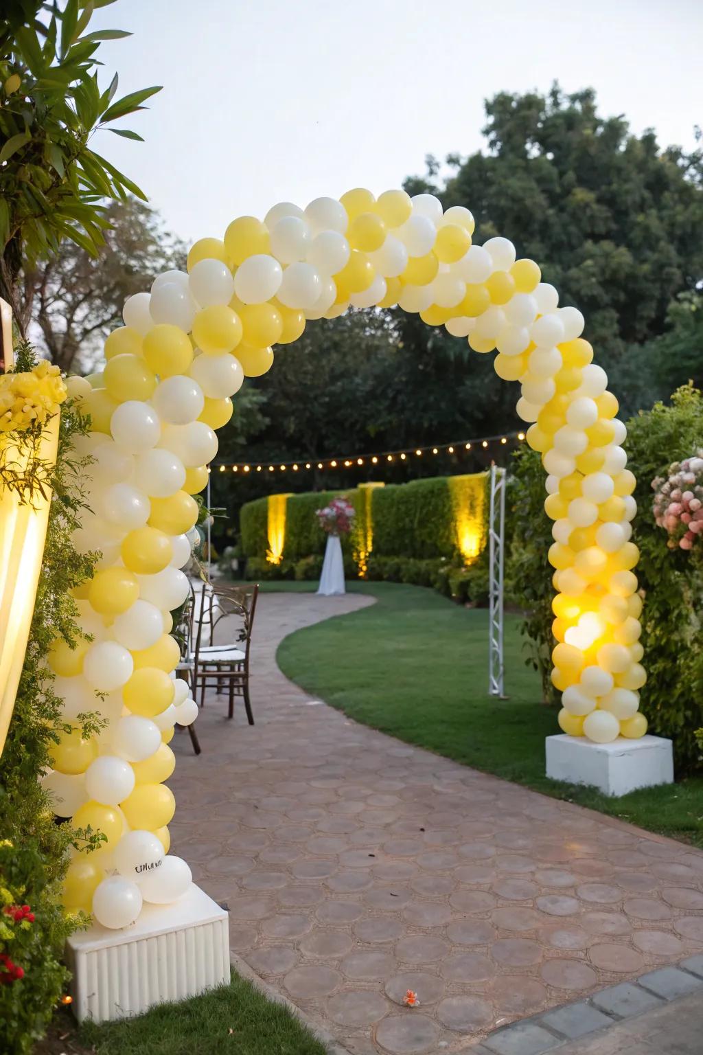 Joyful yellow and white balloon arch for a welcoming entrance.
