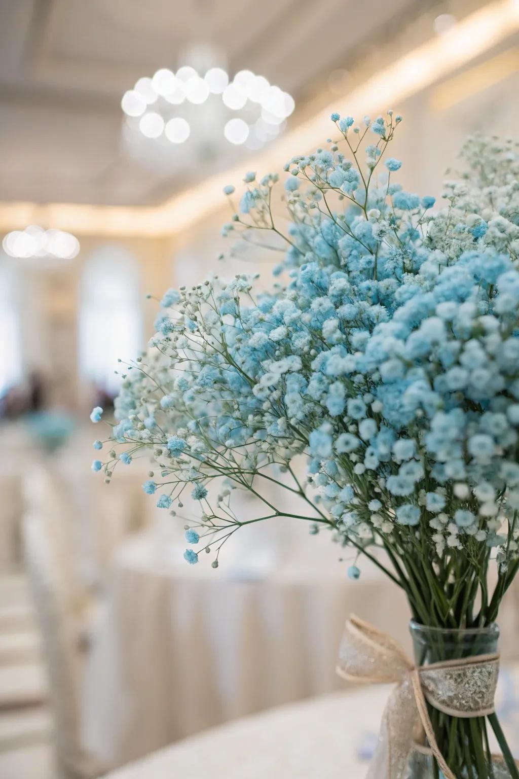 Understated grace with soft azure infant&rsquo;s breath.