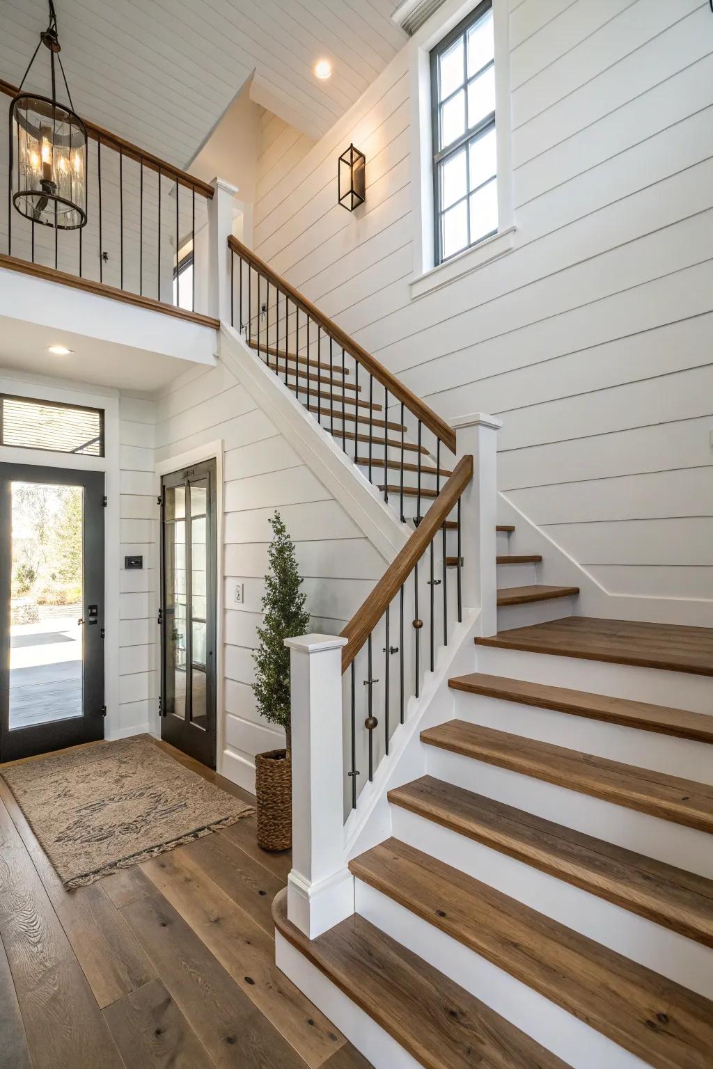 A staircase with a shiplap wall backdrop, introducing texture and farmhouse appeal.