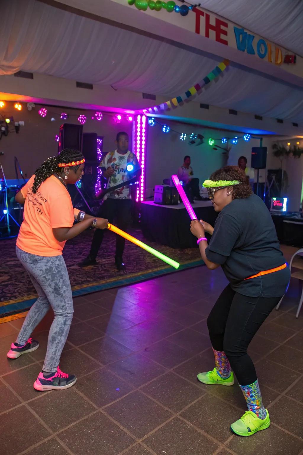 Celebration attendees enjoying neon-themed activities like light stick limbo, adding vibrancy to the festivities.