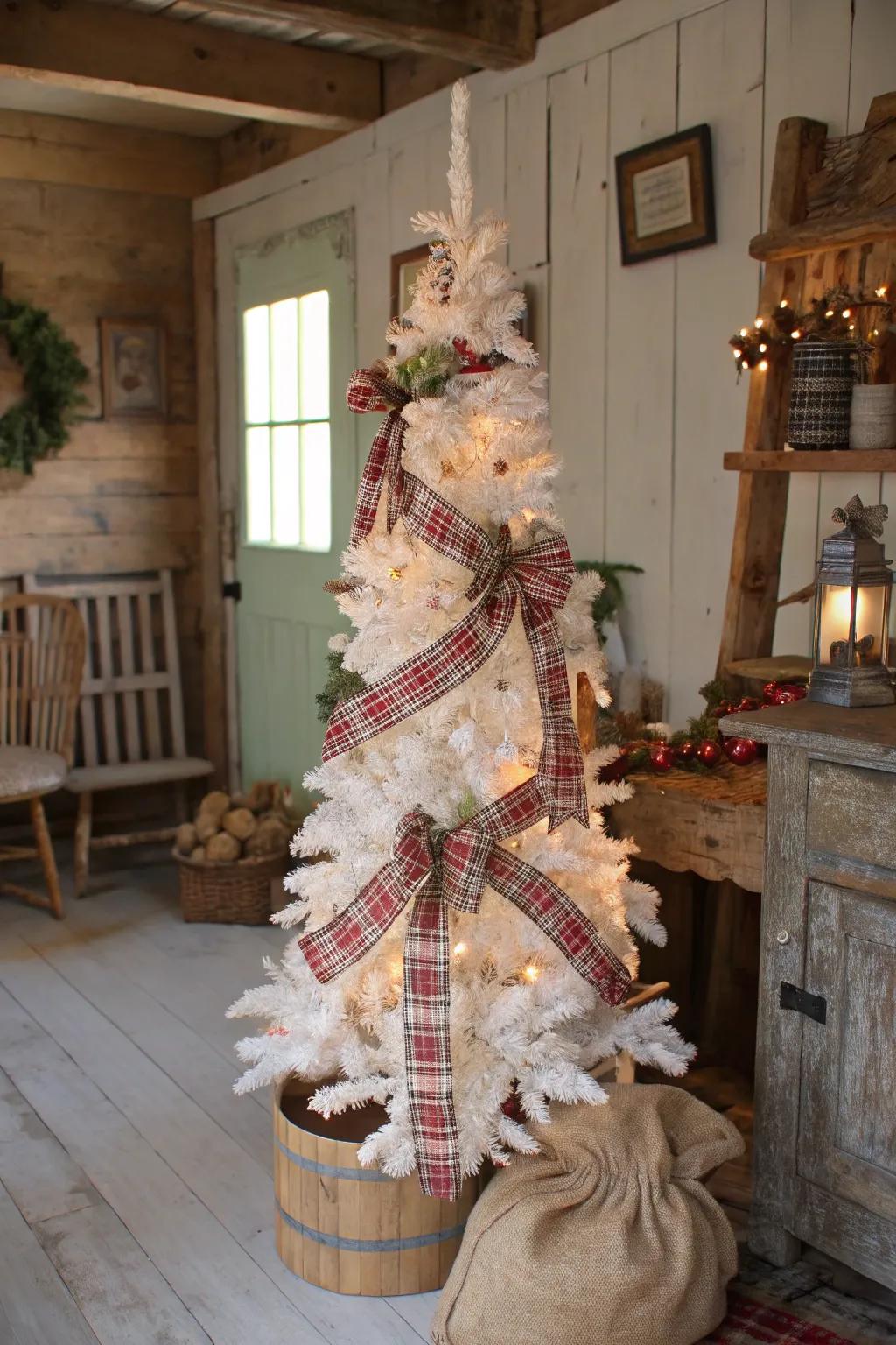 A homespun elegance-themed white pencil tree with hessian and plaid.
