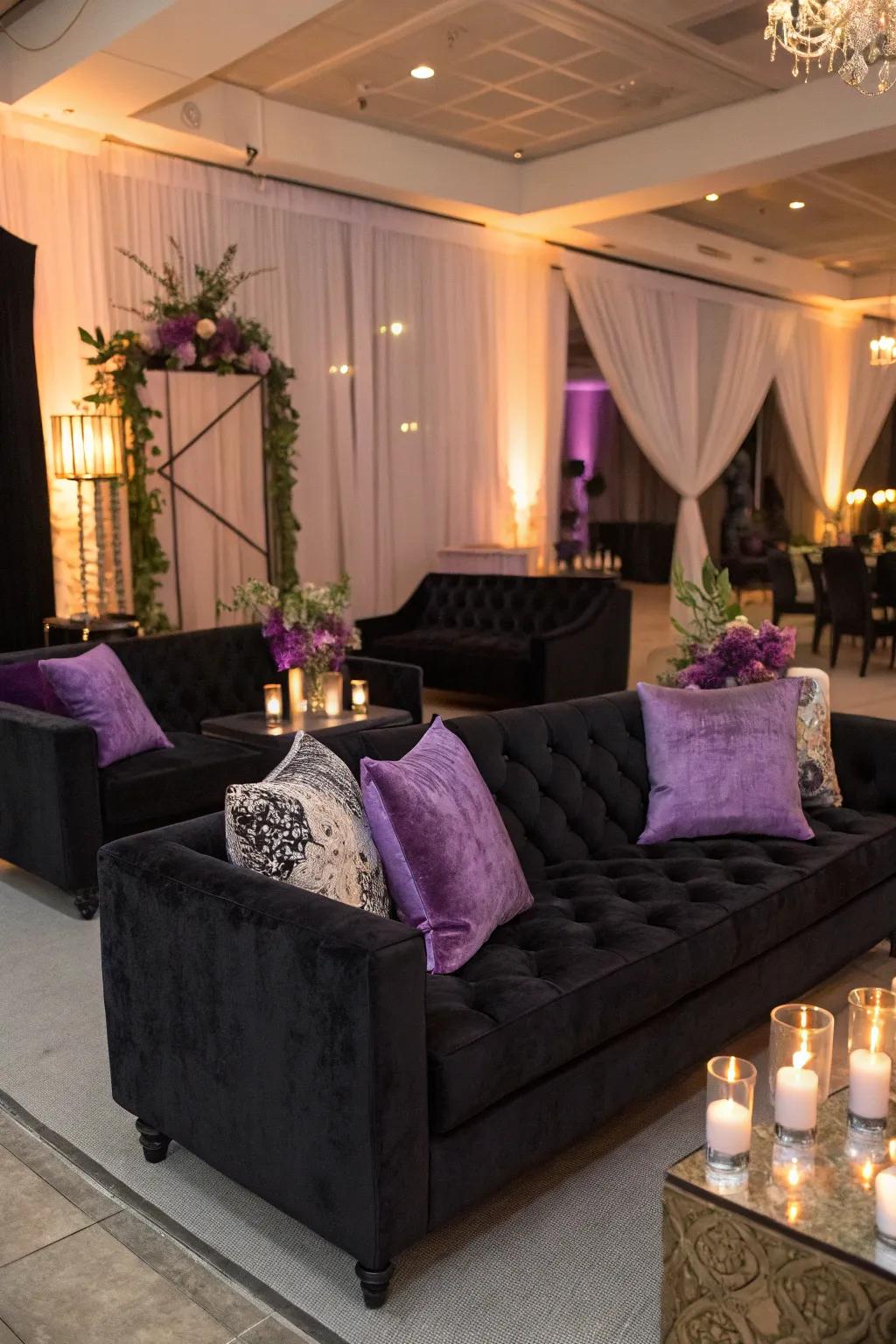 An elegant lounge area featuring dark velvet sofas and purple cushions.