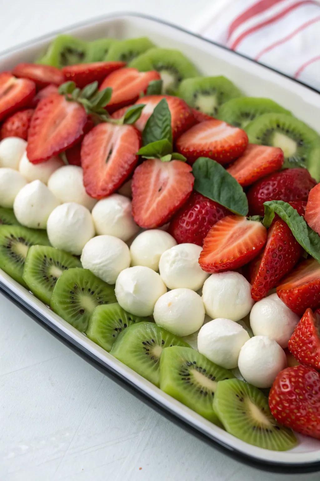 Traditional Christmas colors with fruits and cheese.