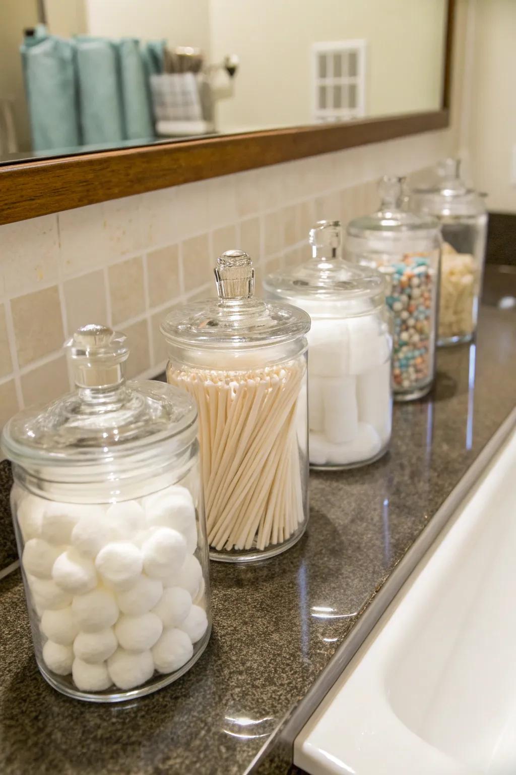 Glass bottles provide an elegant way to store small bathroom essentials.