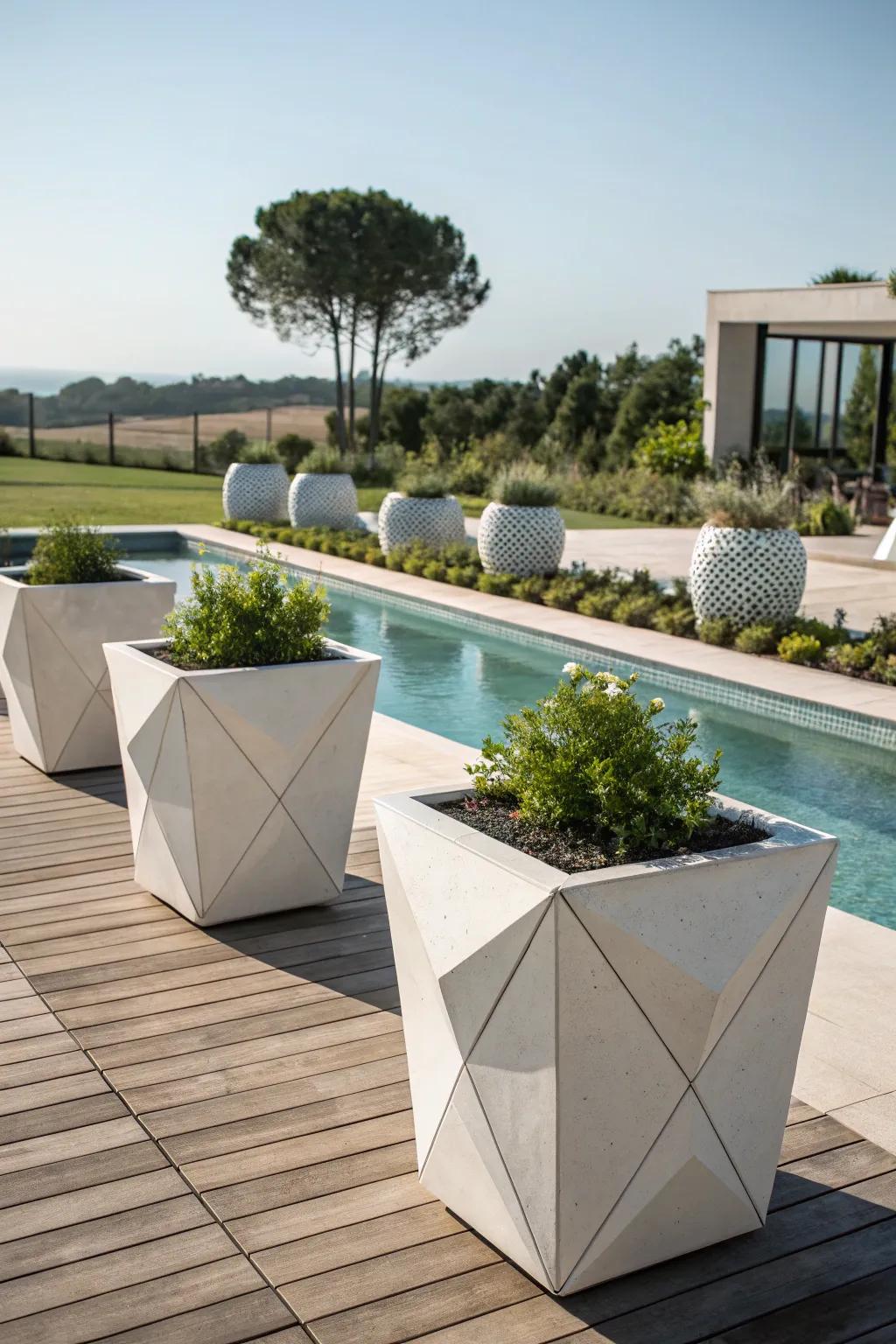 Stylish form with architectural planters on the pool deck.