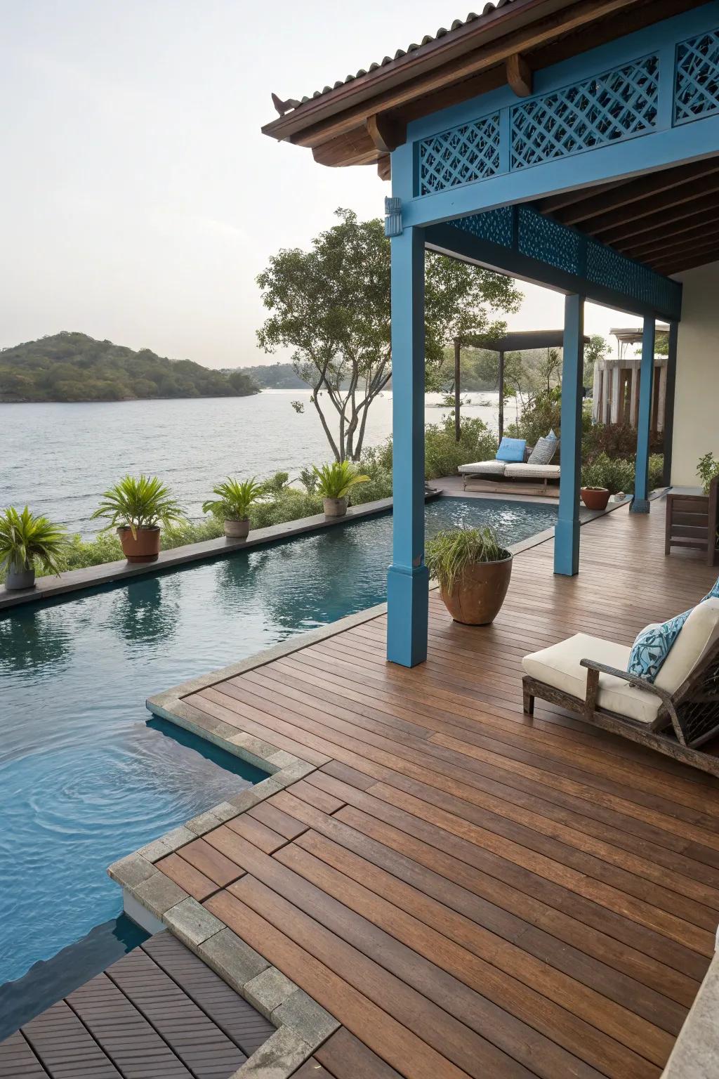 Wooden teak and ocean blue create a tranquil seaside deck retreat.