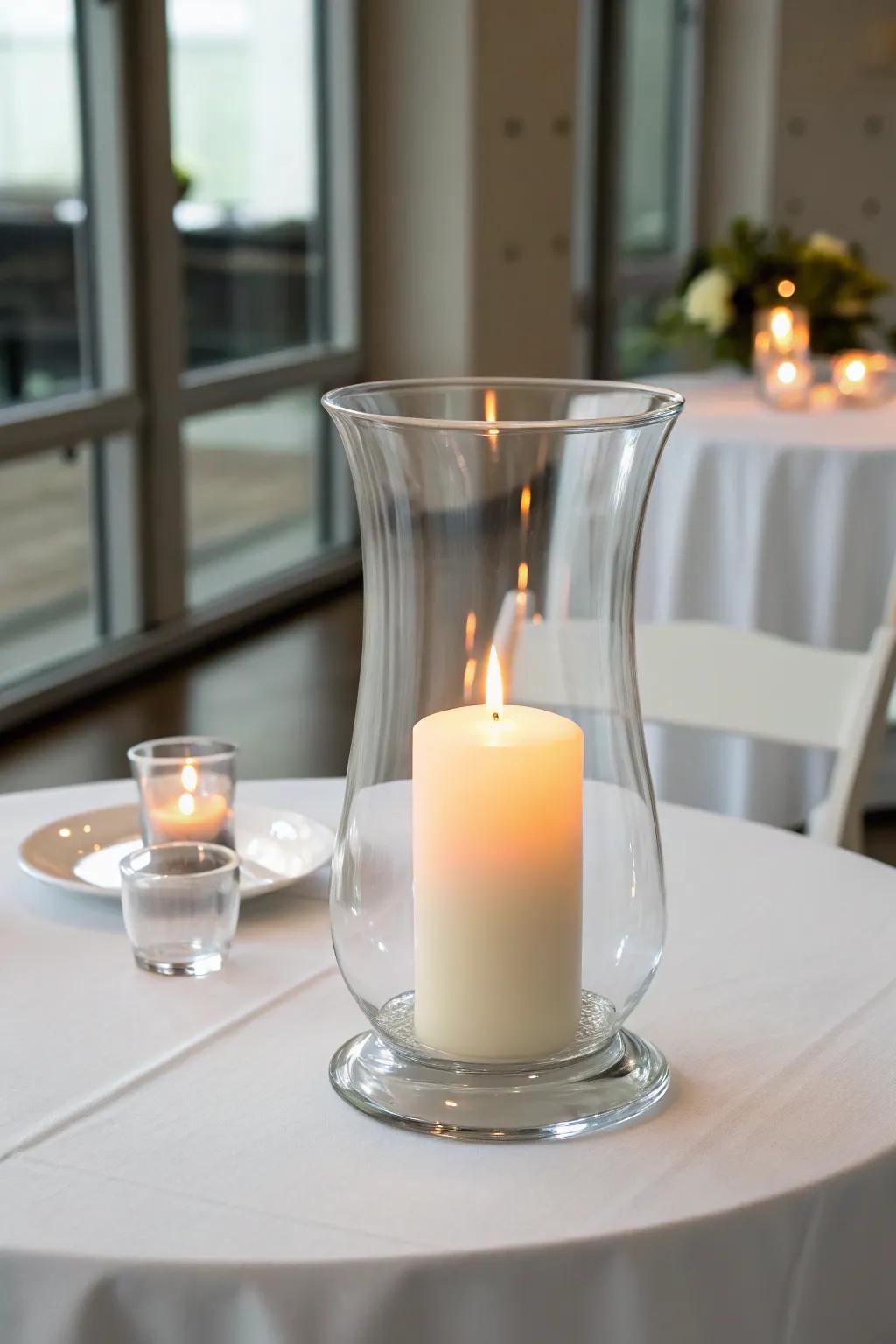 A single tall candle in a hurricane vase for a minimalist and chic look.