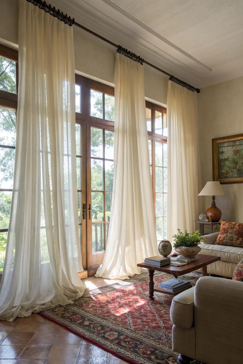 Elegant drape treatments elevate the living space's height and elegance.