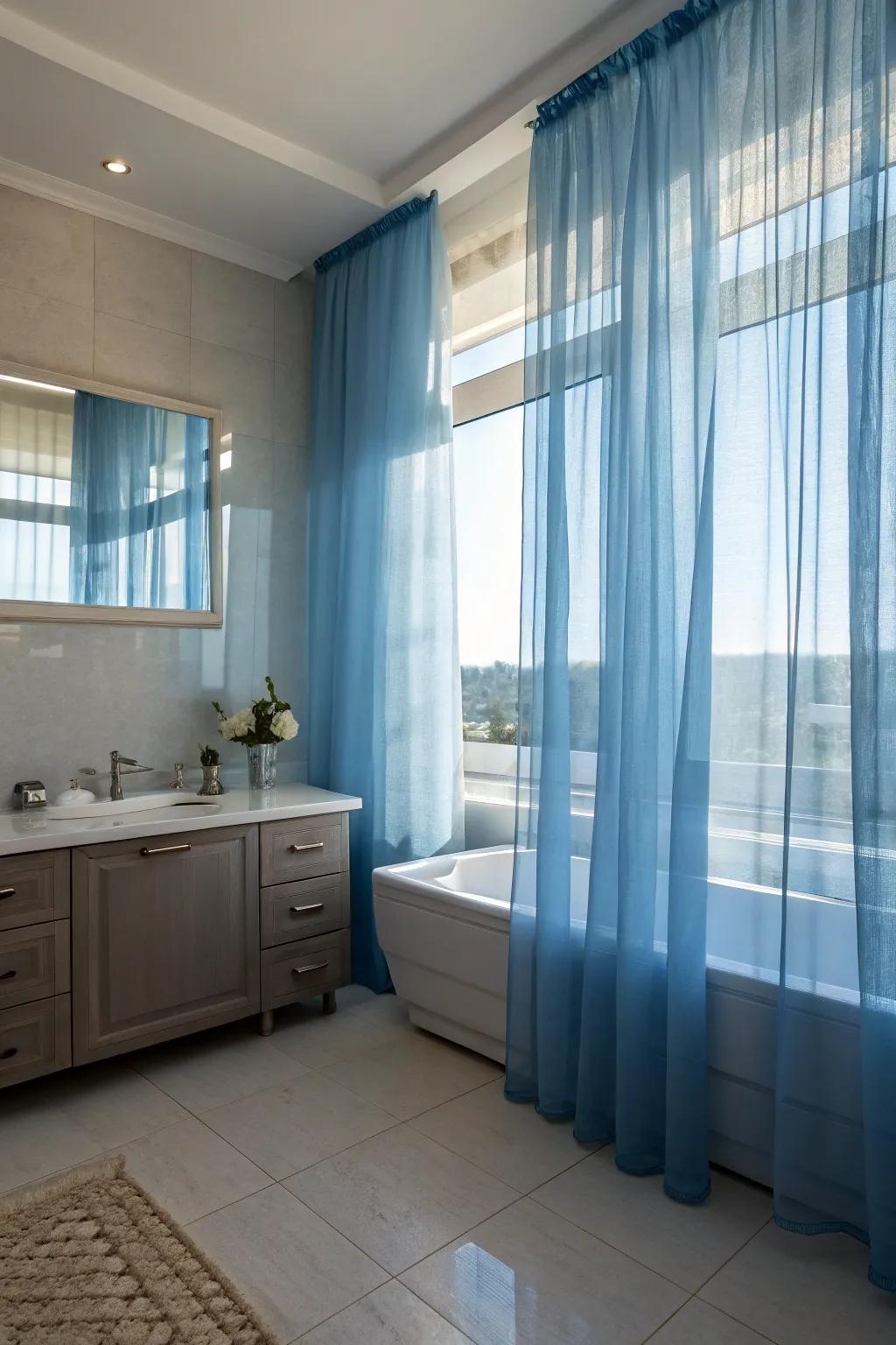Sheer azure curtains furnish seclusion while spawning a dreamy, ethereal ambiance.