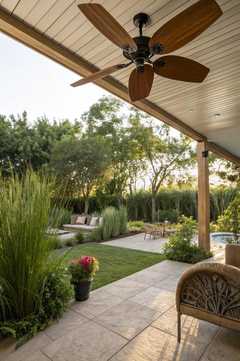 A nature-inspired patio showing off a ceiling fan with wooden blades.