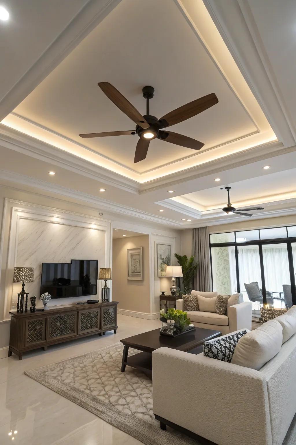 A modern living space featuring a stylish overhead fan with lighting in the tray ceiling.