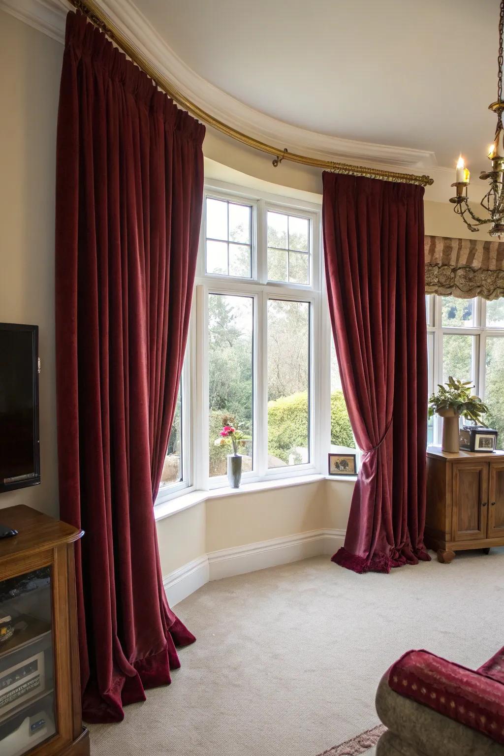 Velvet curtains bring a luxurious and opulent feel to bay windows.