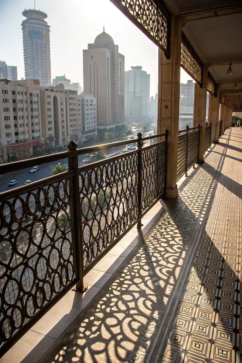 Balcony railing with patterned metal sheets and a cityscape backdrop