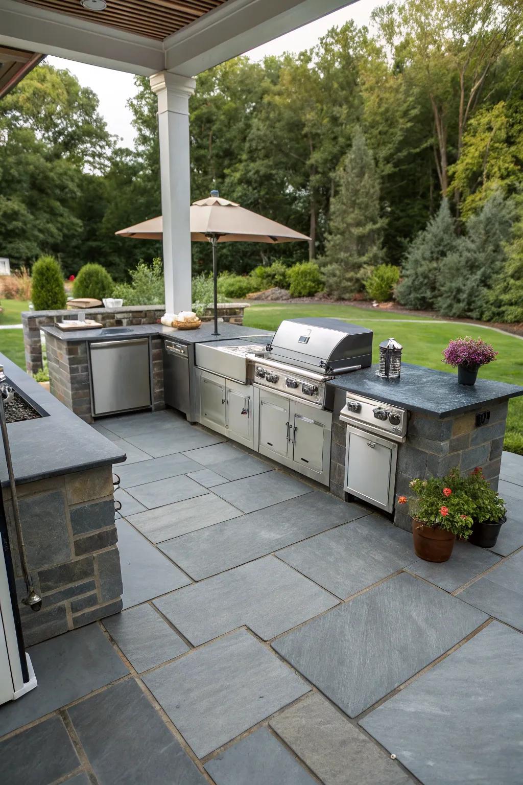 A slate patio featuring a stylish and functional outdoor culinary space.