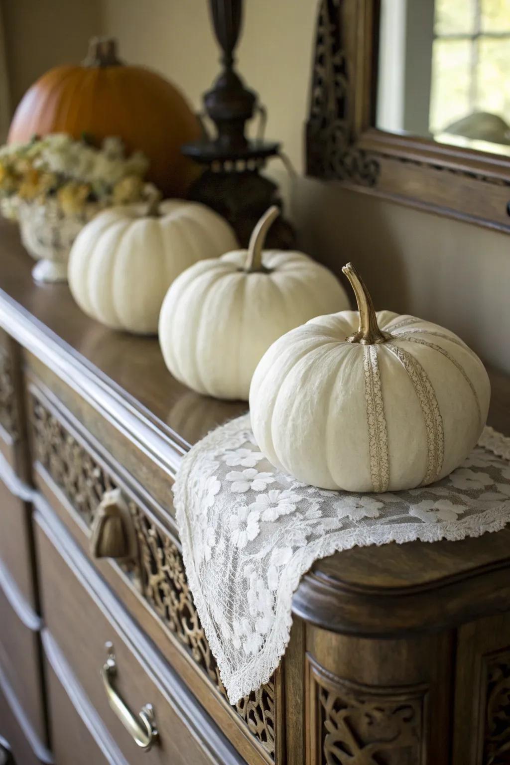 Textile-covered pumpkins for a vintage impression.