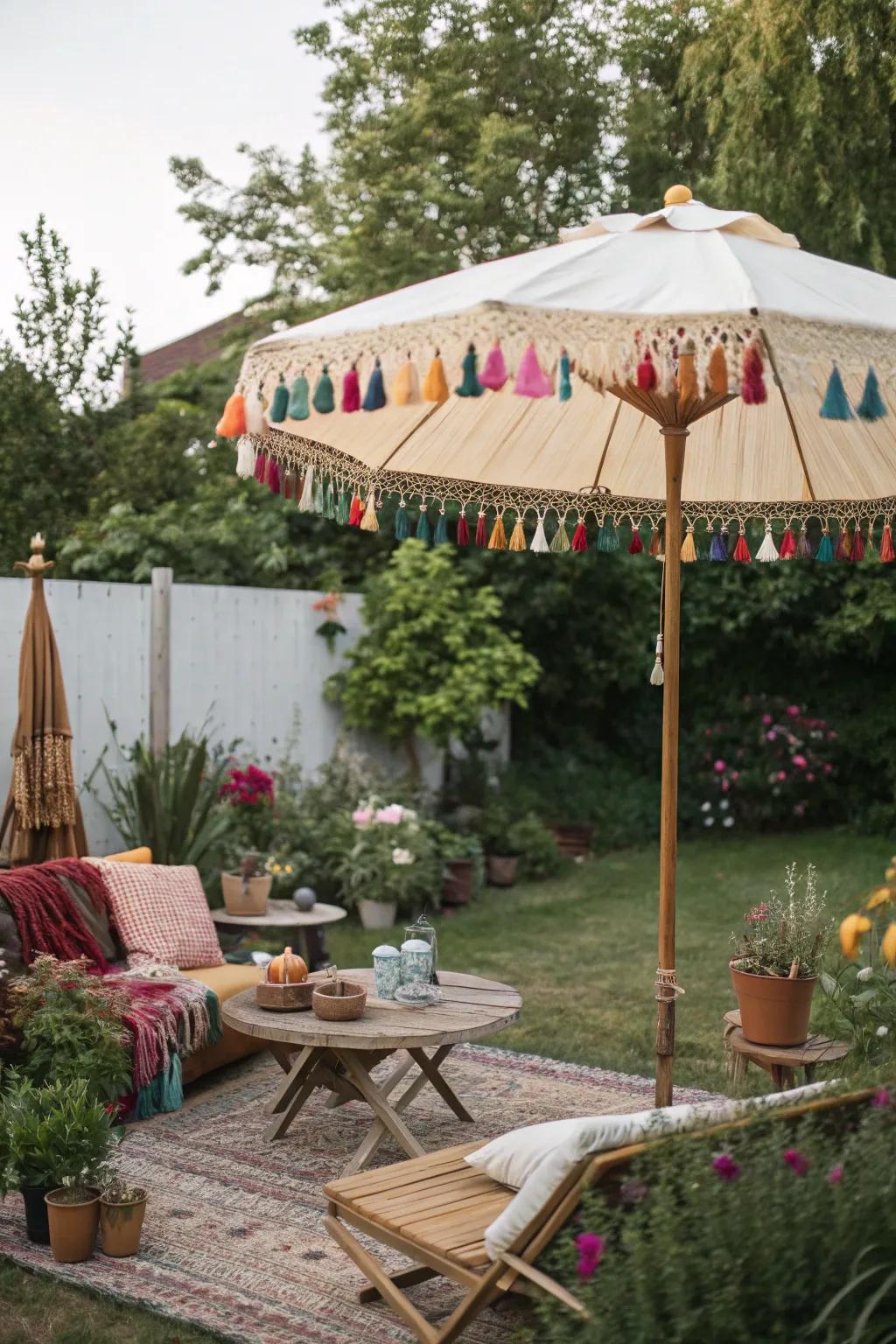 A bohemian backyard with a tassel-adorned sunshade.
