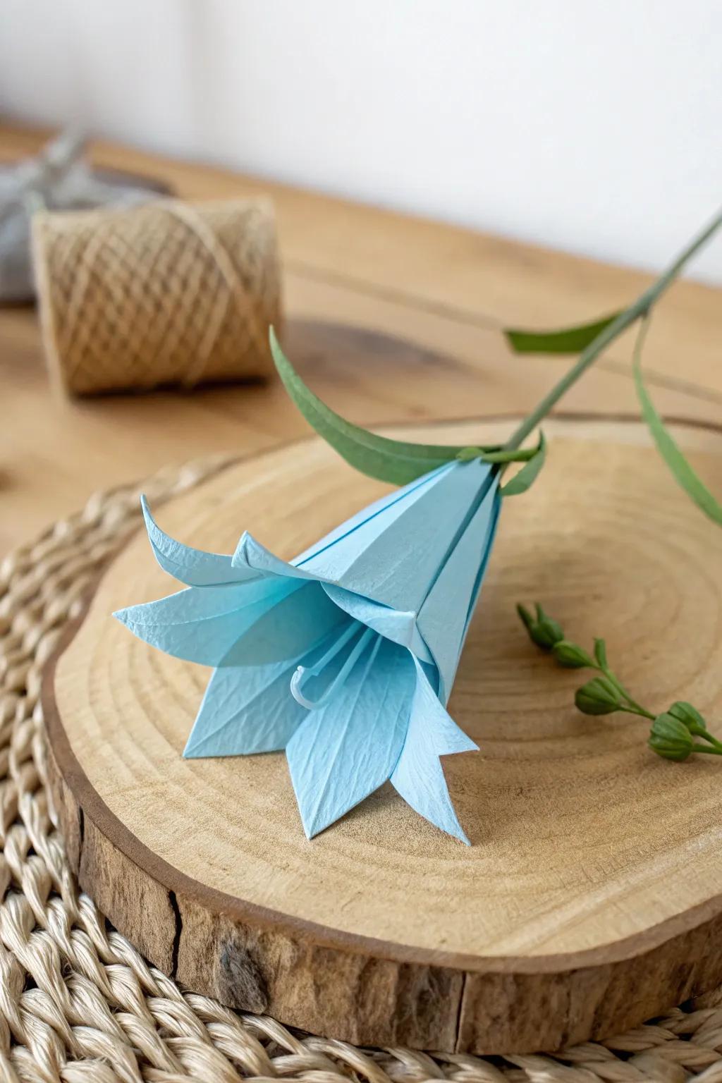 Appreciate the allure of effortlessness with this fragile paper folded bluebell, blending minimalist layout with natural refinement.