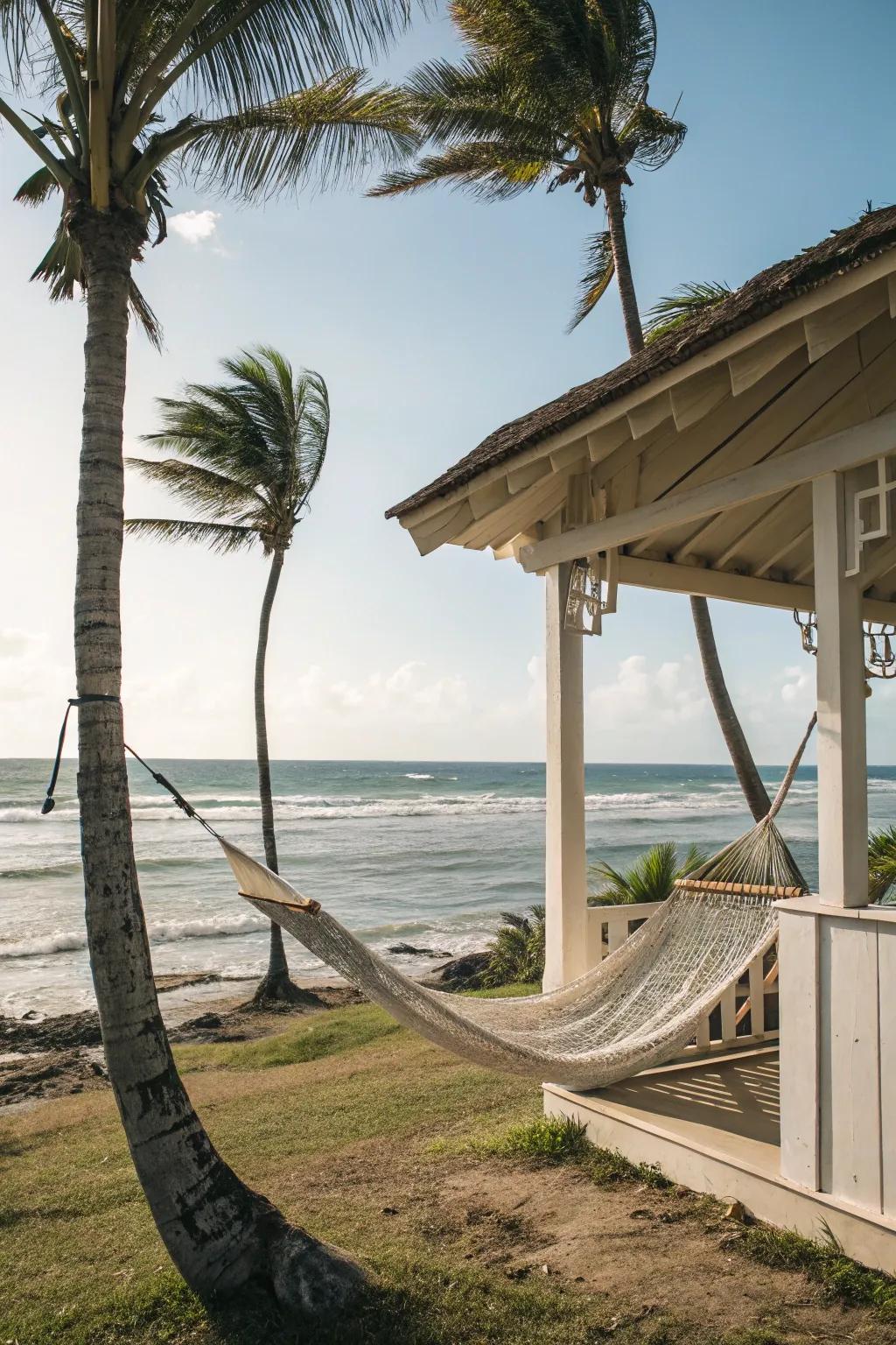 A suspended bed near the beachfront hideaway provides a perfect spot to unwind.