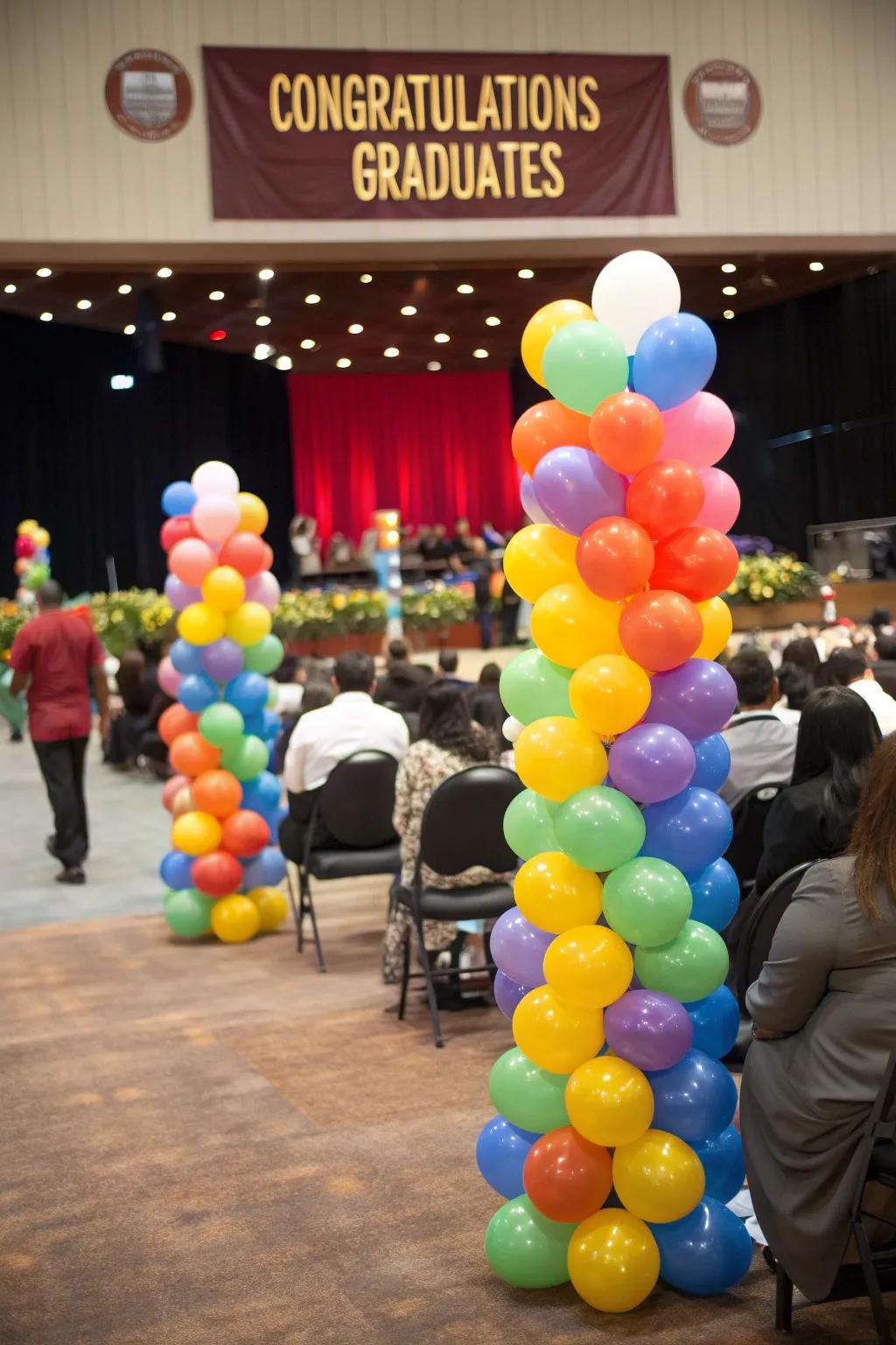 Colorful balloon bouquets add vibrant decor to the graduation setting.