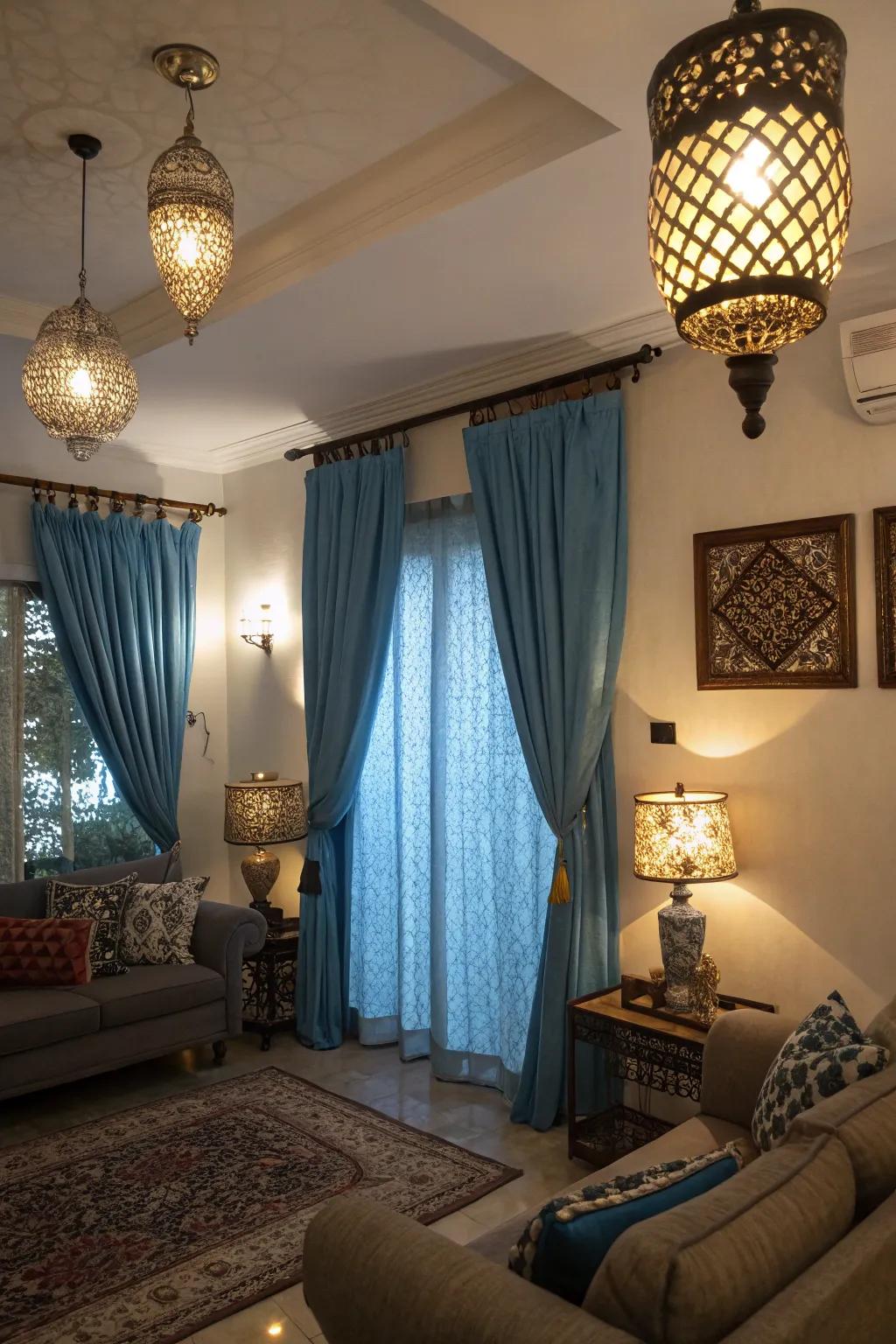 Different illumination fixtures interact with sky-tinted drapes to alter the mood and elevate the room's ambiance.