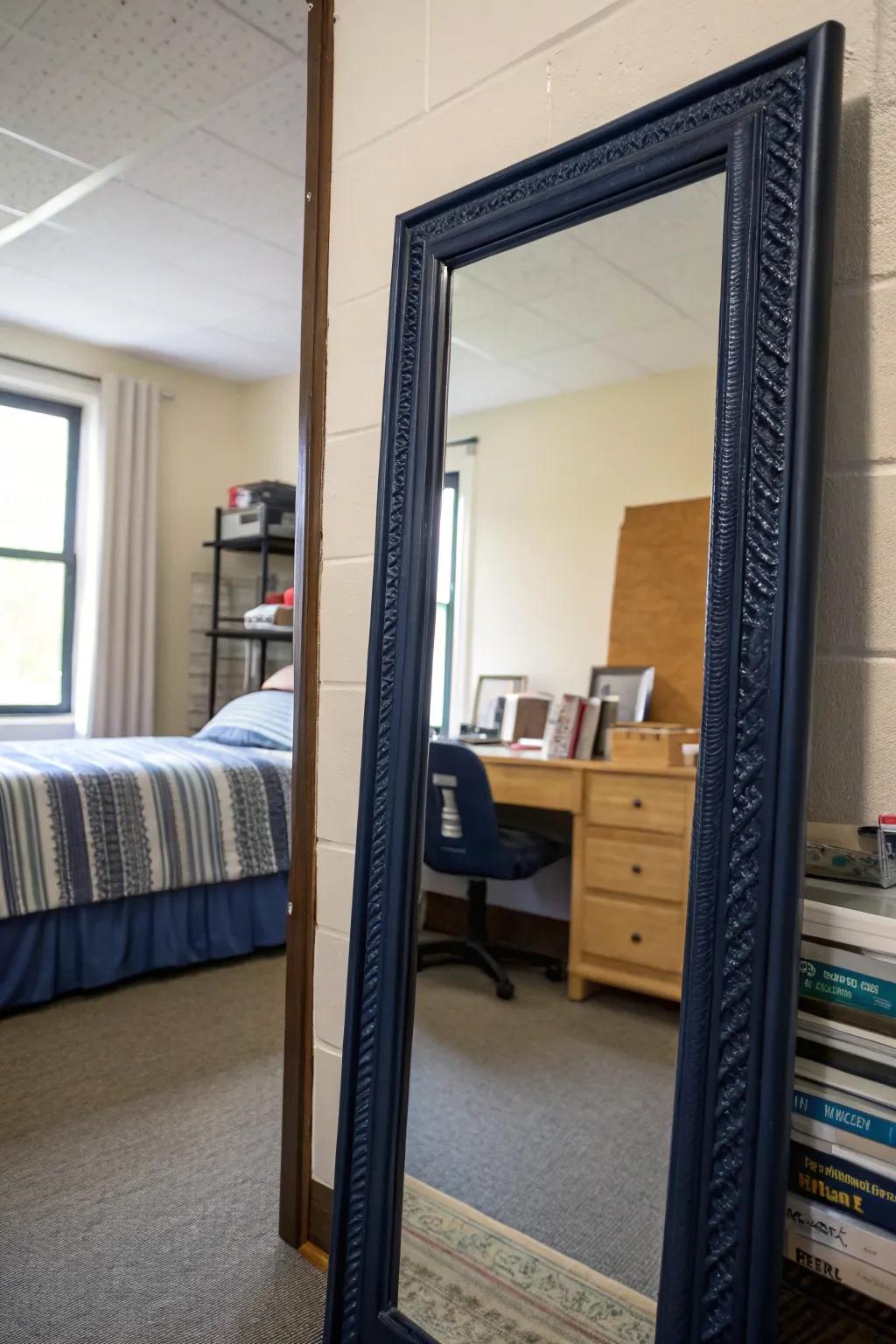 A navy-framed mirror enhances light and style in your room.