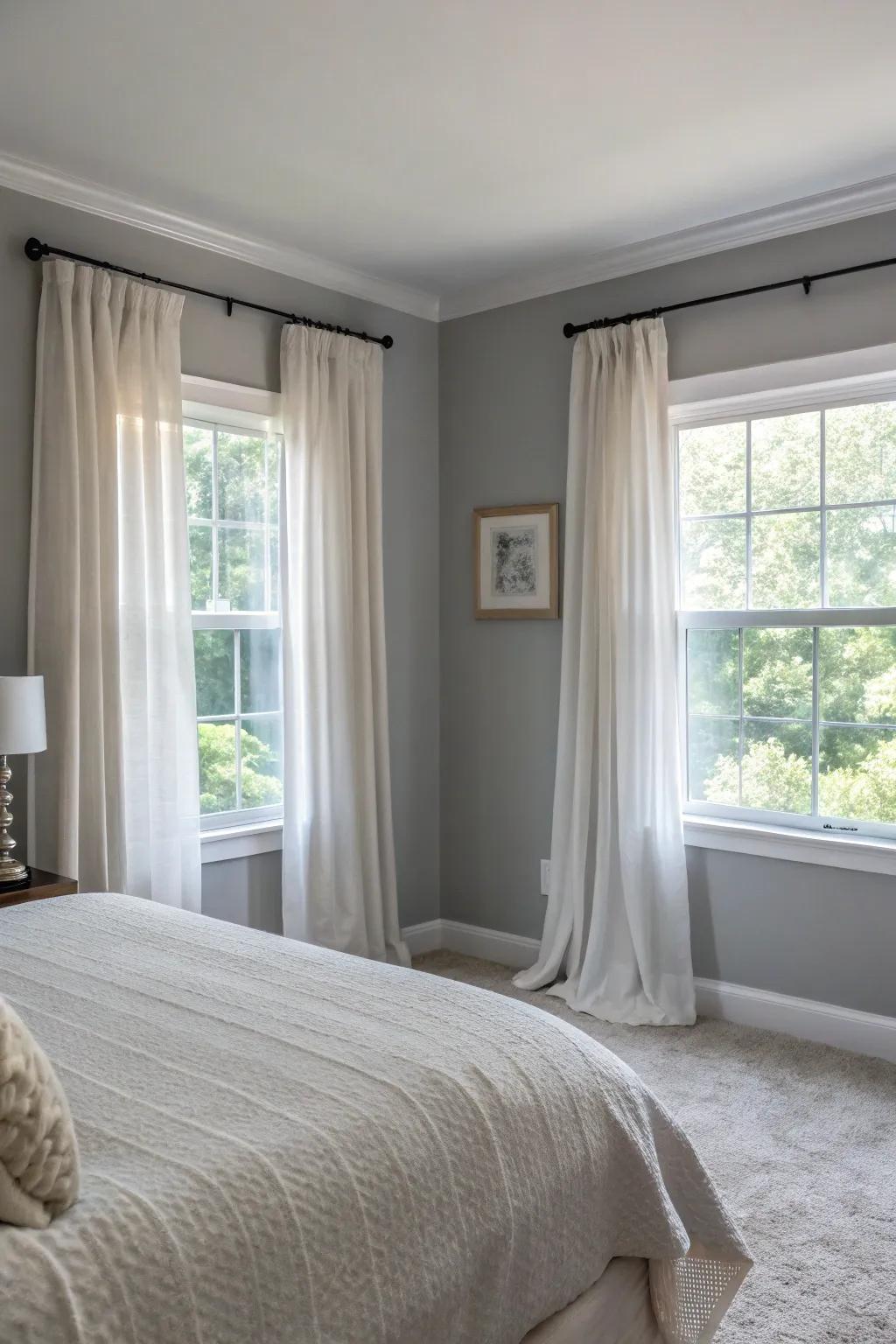Sheer curtains soften the look of a Gentle Gray bedroom.