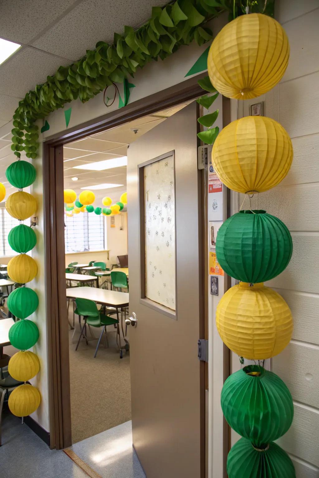Green and gold lanterns hanging around a classroom door, creating a festive glow.