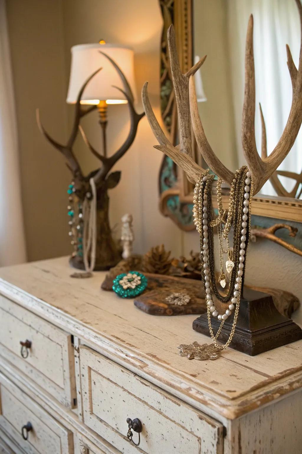Deer antlers used as a jewelry display infuse functional flair into a vintage dresser.