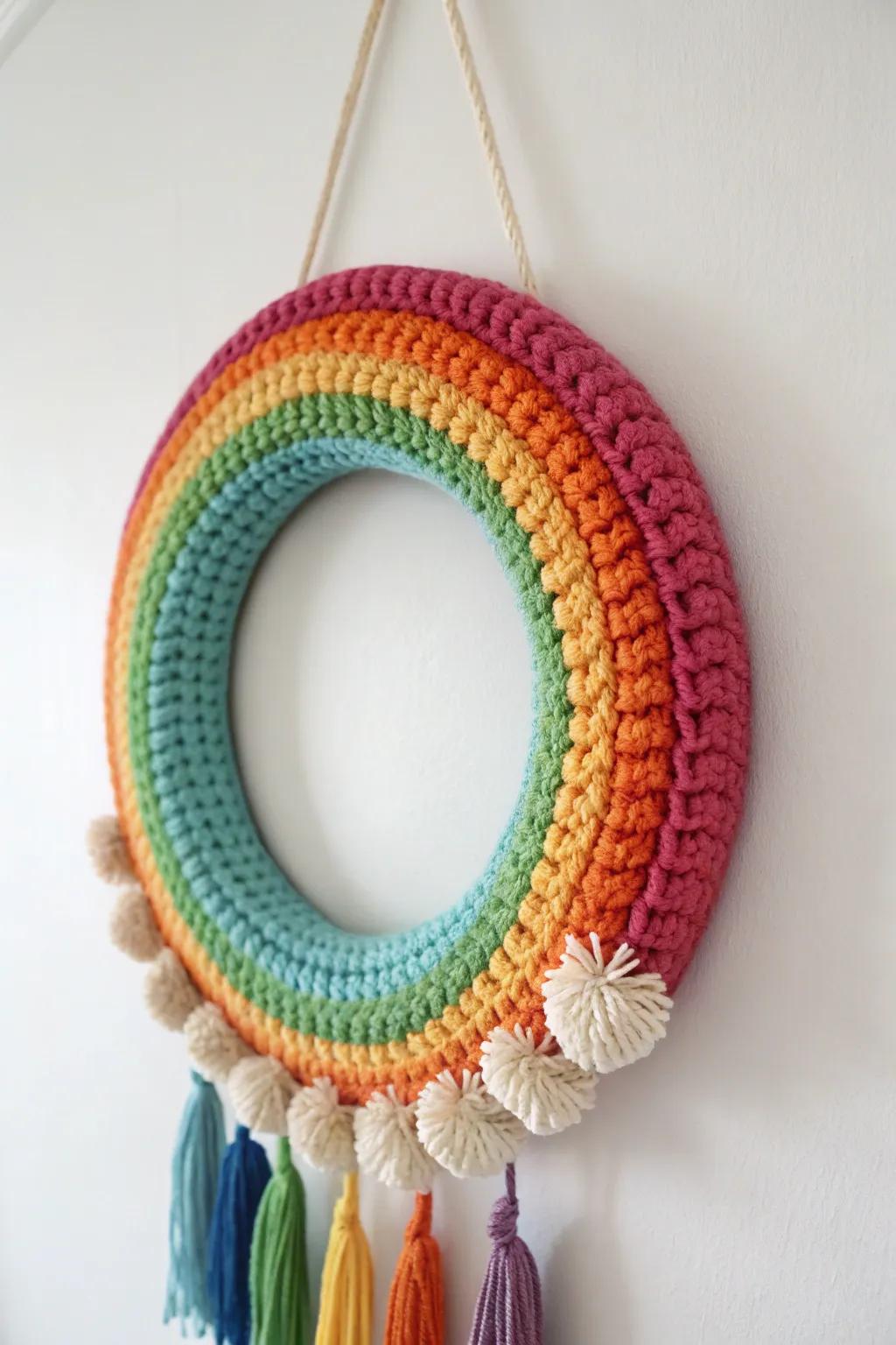 Brighten your space with a burst of color! This handcrafted rainbow crochet wreath is a joyful celebration of every shade.