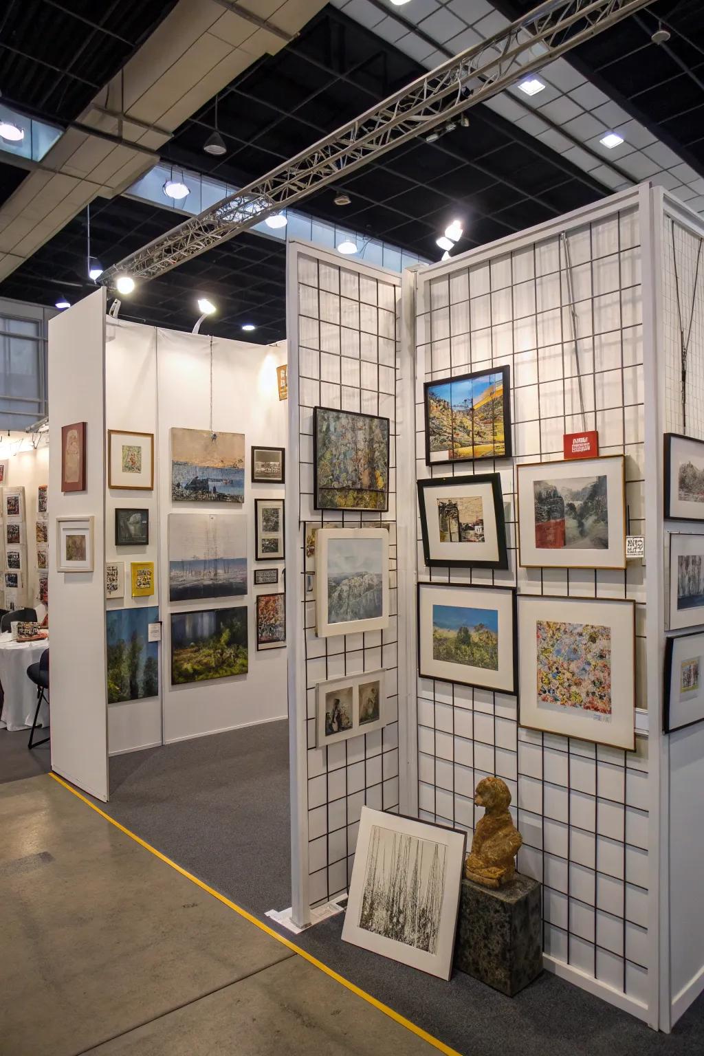 Grid walls in an art booth allow for an efficient and attractive vertical display of artworks.