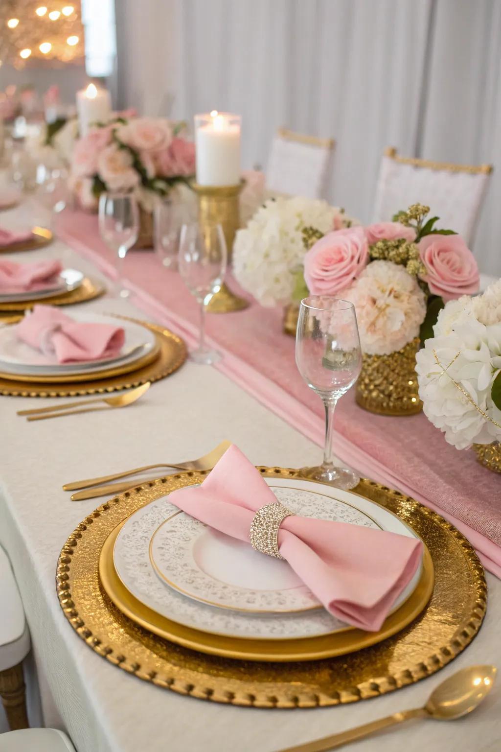 A chic table setting in pink, gold, and white.