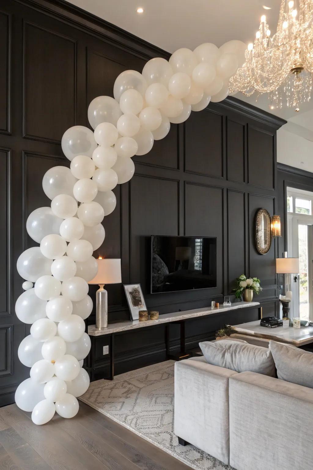 Chic white balloon garland for a refined setting.