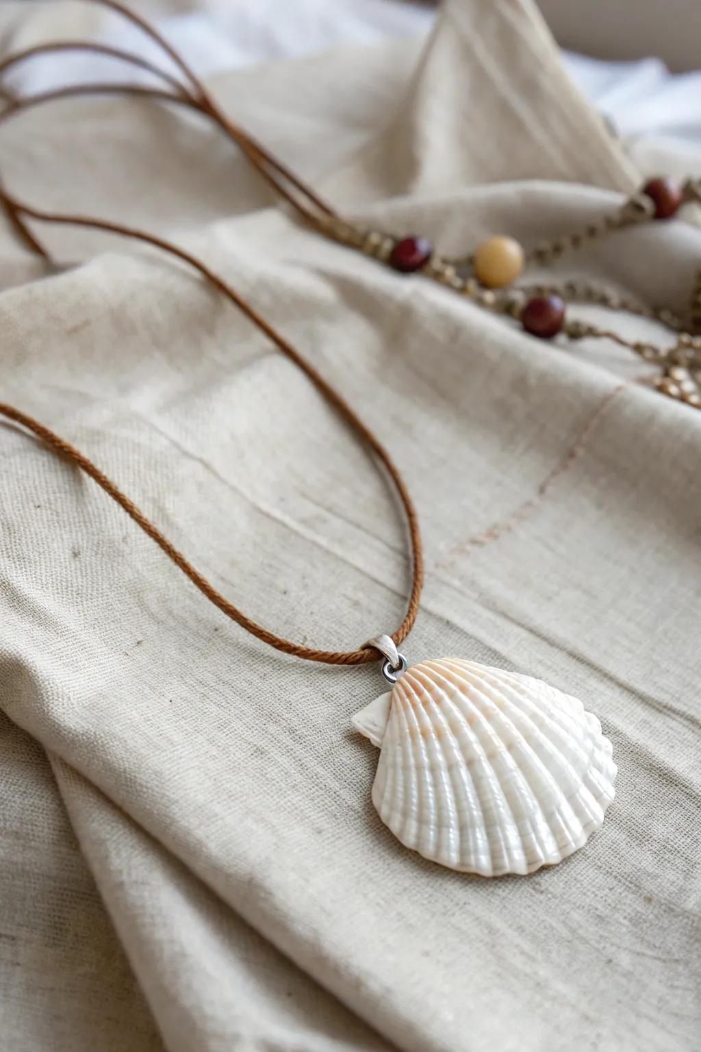 Embrace the allure of the ocean with this artisanal seashell pendant, suited for an elegant coastal accent.