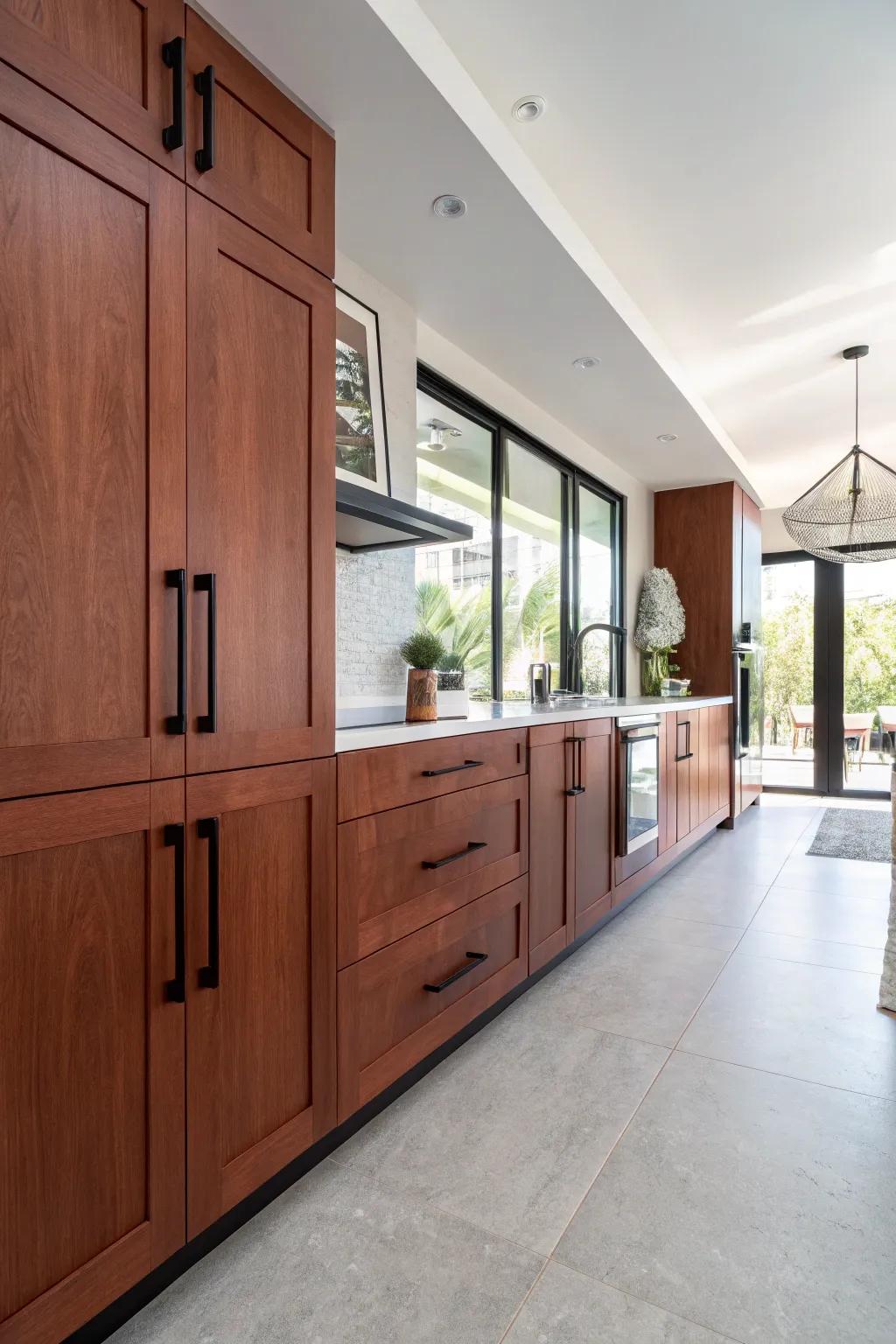 Bold ebony handles add a modern edge to cherry cabinets.