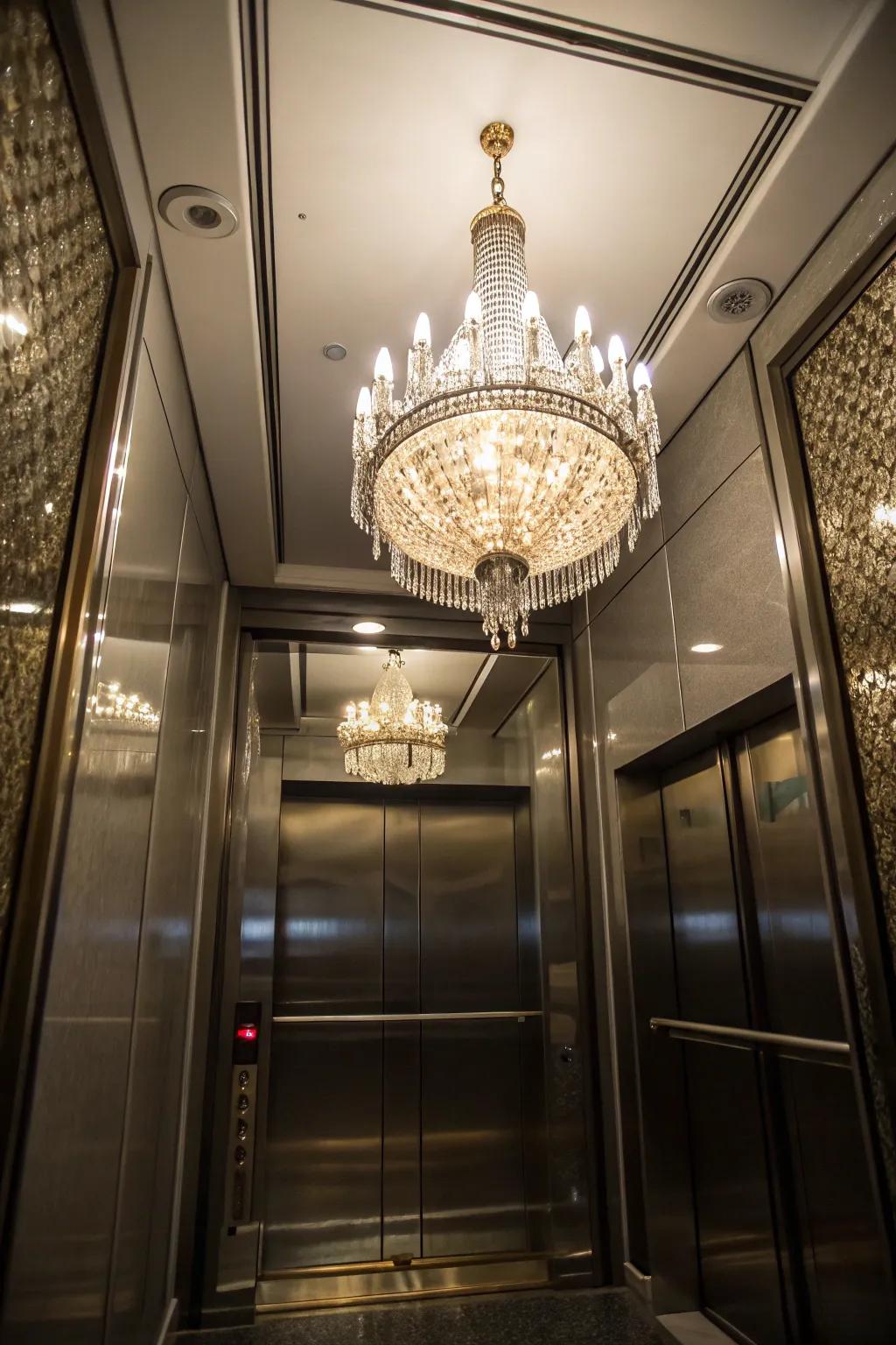 A glimmer of sparkle with a chandelier inside a polished elevator environment.