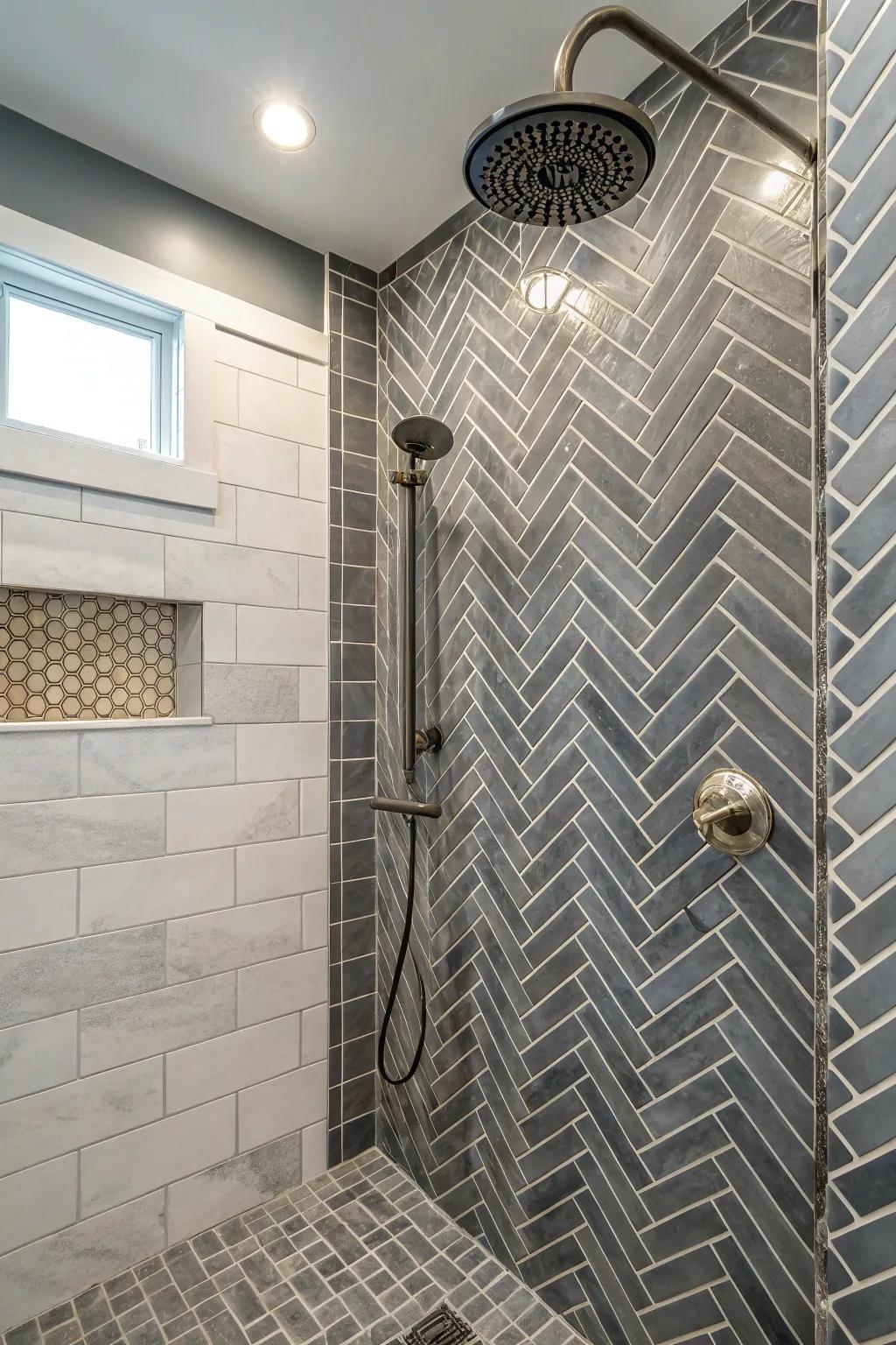 Harmonious blend of chevron and brick patterns using grey tiles.