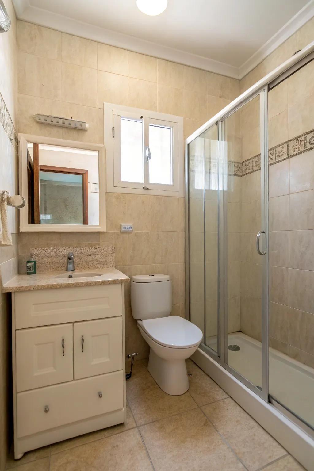 A minimalist beige bathroom featuring sleek lines and uncomplicated decor.