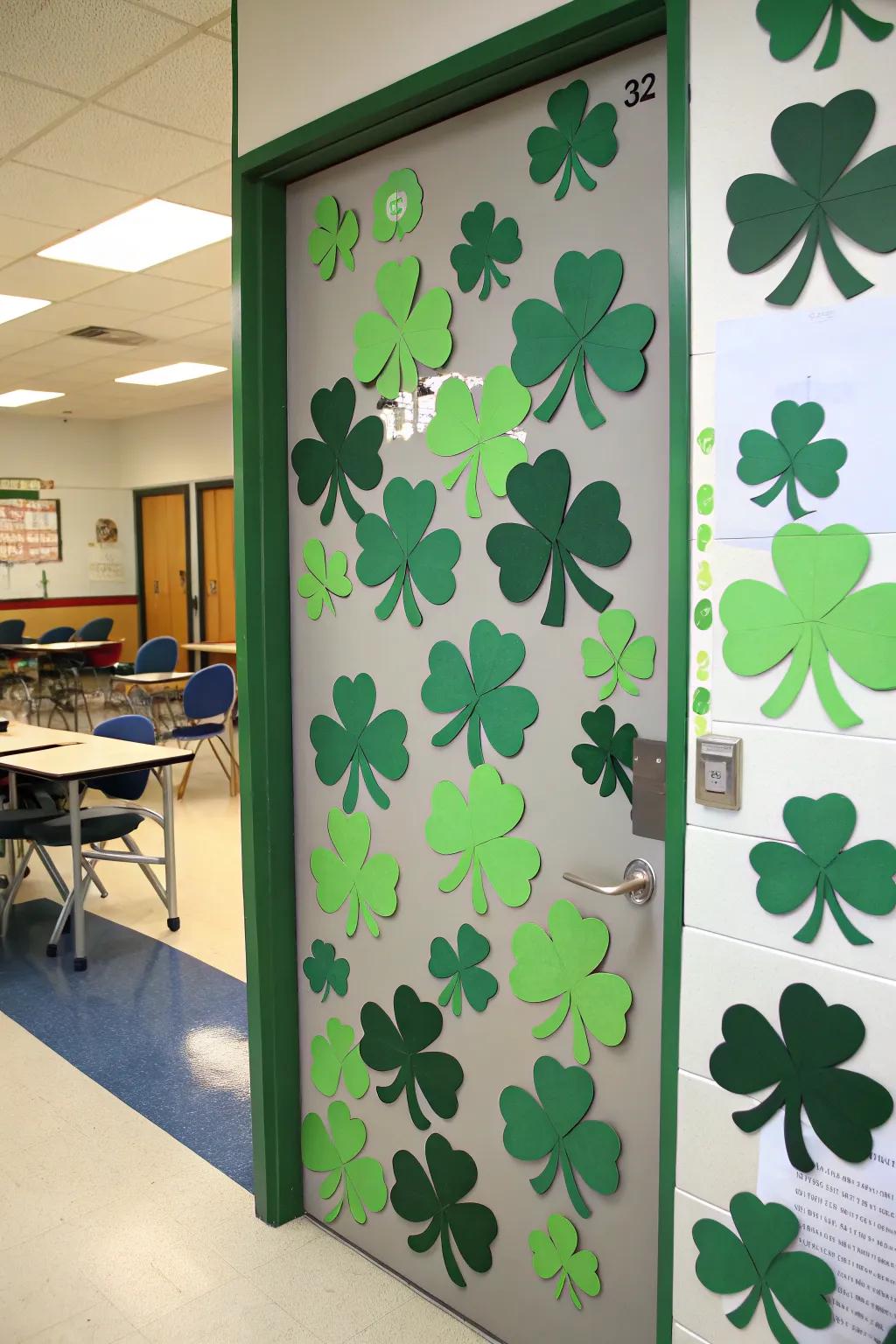 A classroom door adorned with green shamrocks, perfect for St. Patrick's Day.