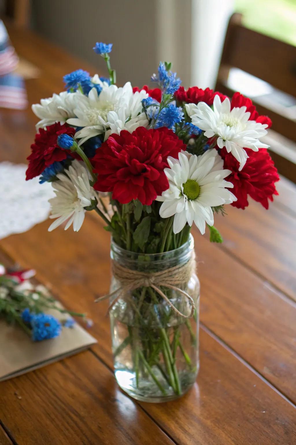 Patriotic flowers presented in a quaint cottage-style jar arrangement.