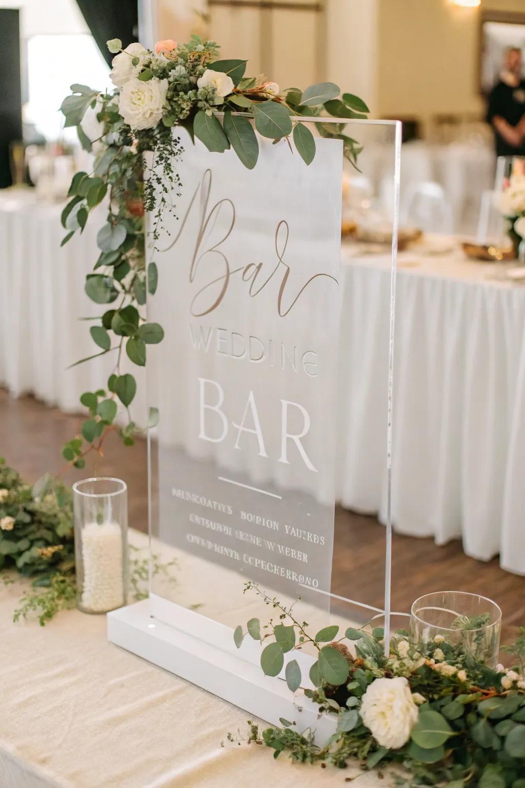A stunning acrylic bar sign showcases modern fonts and plant life.